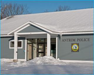 police building with snow on the roof and ground